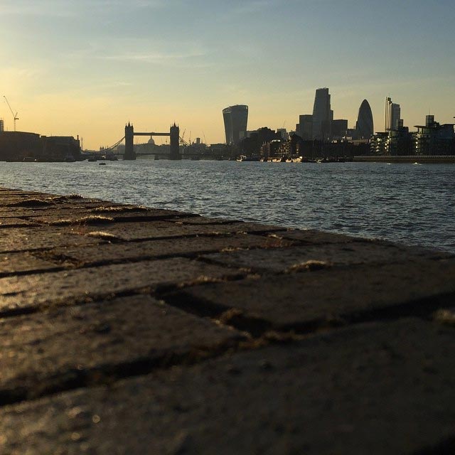 A photo of Tower Bridge as the sun sets over London